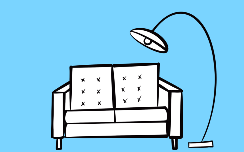 Das Bild zeigt ein Sofa und eine Lampe und ist das Logo unsere karla Wohnzimmers.